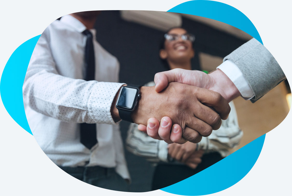 two people shaking hands in a business manner